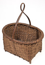 Footed Basket with Tall Twisted Handle