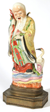 EARLY CHINESE PORCELAIN FIGURE OF IMMORTAL 