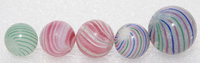 FIVE CLAMBROTH & BANDED OPAQUE MARBLES