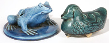 TWO ARTS & CRAFTS POTTERY FIGURAL FLOWER FROGS 