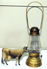 BRASS SKATER'S LAMP & DELAVAL COW