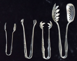 Four Sterling Tongs