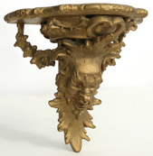 CARVED GOLD SHELF WITH MEDIEVAL HEAD